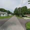 Woman reports past battery at Maple Street home