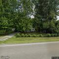 Power lines down between pole and residence