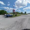 Man possibly unconscious in car near dumpster at hotel