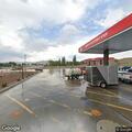 Man found slumped over driver's seat at gas station