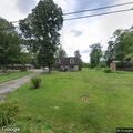 Tree blocks road and rests on wires