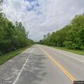 Motorcycle passes car into oncoming traffic on MO 210