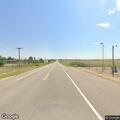 Truck with flatbed trailer runs port checkpoint