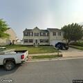 Person with headache near Cove Point Road and Sandwood Road