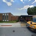 Female found in green sleeping bag at school entrance