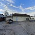Male lying in parking lot at Clay City Beverage Place