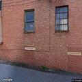 Man pacing behind building near North Fourth Street