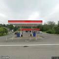 Truck leaves gas station with fuel hose attached