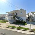 Loose utility wire secured near residence