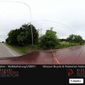 Older man walking in road and yards near Highway 10