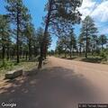 Ranger transports patient from trail to trailhead