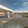 Man laying on sidewalk appears to be hallucinating in Grafton