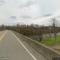 Man passed out in blue SUV at Meadowbrook Road bridge