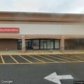 Female experiencing stomach pain at post office