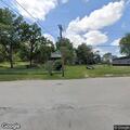 Officer directs traffic at dark intersection