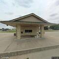 Female employee having trouble breathing at bank
