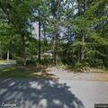 Person having respiratory emergency on porch near Maple Ave