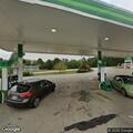 Traffic stop at gas station near highway ramp
