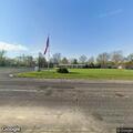 Traffic stop involving red Lincoln at funeral home
