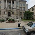 Man asleep near courthouse tent
