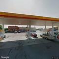Person asking customers for money at gas station