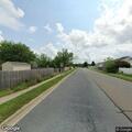 Person experiencing back pain on Greenlawn Boulevard