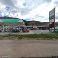 Suspicious man loitering in back of gas station