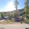 Smoke reported near trees by mobile home park