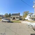 Abandoned trailer with wrecked car on top reported