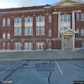 Person lying outside United Methodist Church in Atchison