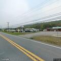 Female walking roadside appearing scared at Valley Road
