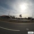 Person experiencing headache at motel parking lot