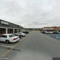 Person experiencing chest pain at shopping plaza