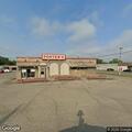 Man found lying behind laundry building