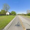 Red pickup driving erratically on Fry Road