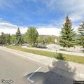 Person dumping waste in Rainbow Park parking lot