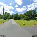 Person experiencing back pain near Anderson Road