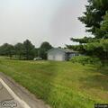 Person lying on ground breathing fine near Route 201 and 555