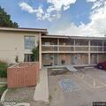 Female aged 22 with anxiety at Aurora motel lobby