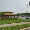 Person located behind liquor store near bridge