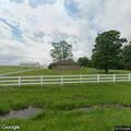Male trapped by legs in farm equipment in Tuscola