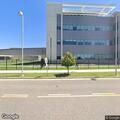 Person experiencing abdominal pain at hospital location