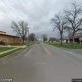 Man knocking on door on Beech Street in Clarence
