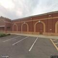 Dumpster fire next to building in Logan Township