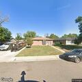 Person experiencing back pain at North Tucson Street