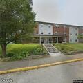 Officer serving traffic citation at apartment