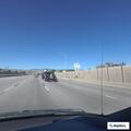 Vehicles on shoulder and animal carcass on I-70 ramp