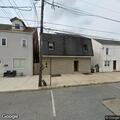 Person experiencing chest pain at pub apartment