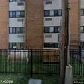 Fight between two men behind apartment building
