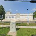 Person slumped over behind wheel at White Castle